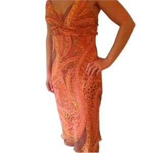 Brightly patterned orange lined dress.